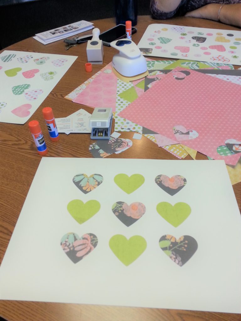 Paper with hearts glued on
